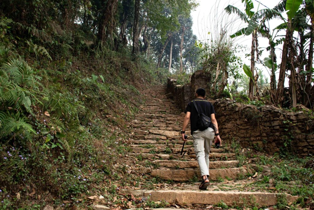 Hiking to Peace Pagoda from Fewa Lake, Pokhara. A very peaceful, clean and green walkthrough path. To reach this place, take a boat from Fewa Lake, cross the lake and you will reach the place. A beautiful place to travel with waterfall on the way.