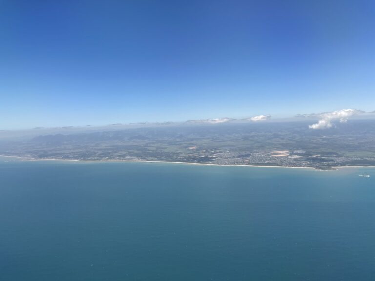 The coastline of the state of Espírito Santo, Brazil. Green sea and blue sky.